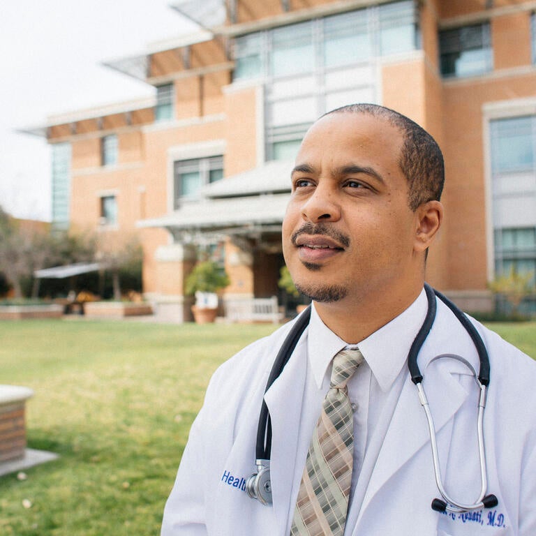 Physician wearing a coat and stethoscope