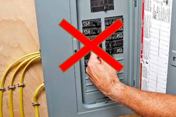 Open electrical panel with red X over it