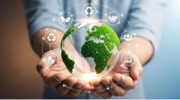 hands holding earth surrounded by sustainability concepts