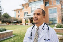 physician wearing a white coat